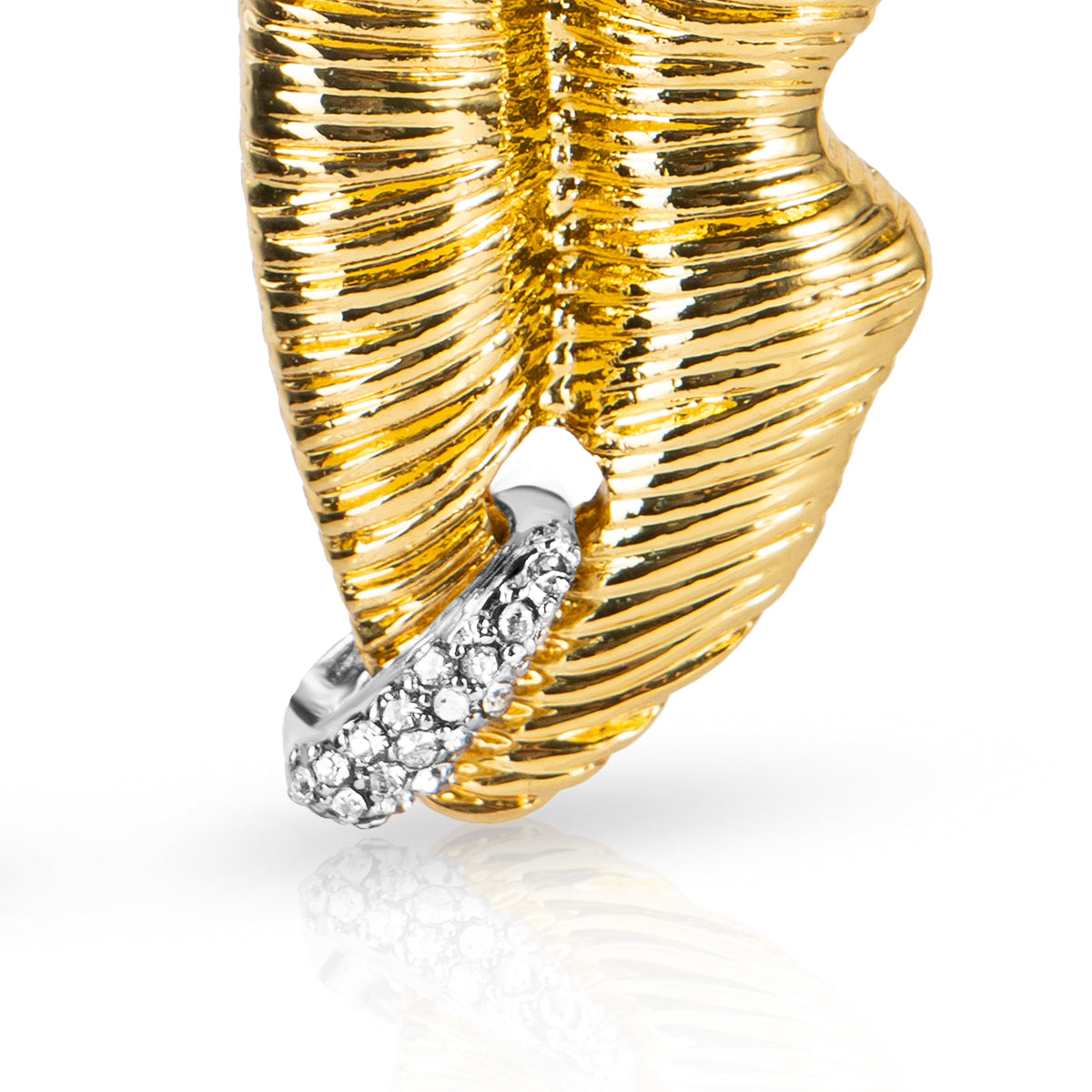 Gold lip shaped earring with diamond accents on a white background