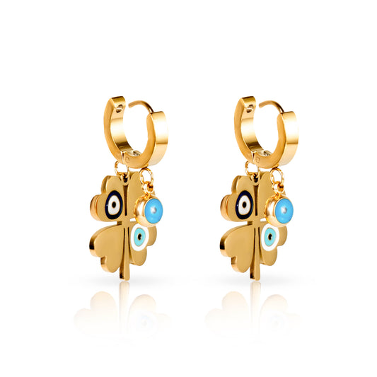 Gold four-leaf clover earrings with blue evil eye design on a white background