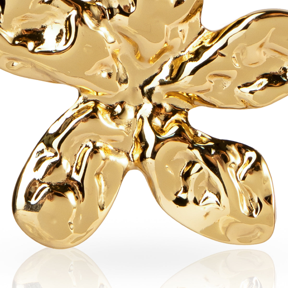 Gold earring on a white background