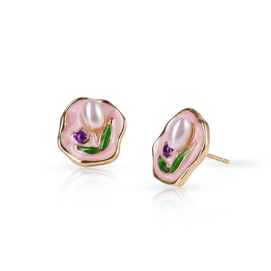 Pair of earrings with pink floral design on a white background